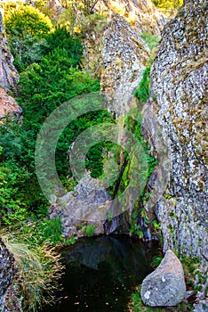 Waterfall in Manteigas Town, Serra da Estrela or Mountain of Star in Portugal called Poco do Inferno or Hell Pit photo