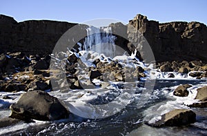 Waterfall into The Mid Atlantic Rift, Pingvellir, Iceland