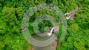 Waterfall in the middle of the forest. Bird eye view , drone