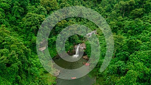 Waterfall in the middle of the forest. Bird eye view , drone