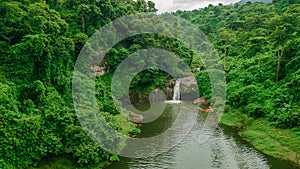 Waterfall in the middle of the forest. Bird eye view , drone