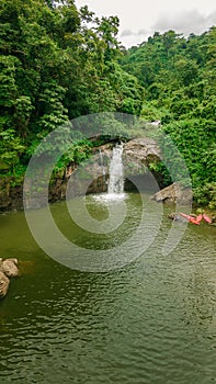 Waterfall in the middle of the forest. Bird eye view , drone