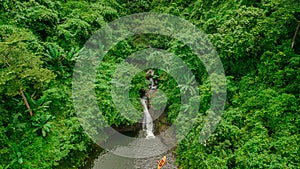 Waterfall in the middle of the forest. Bird eye view , drone