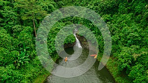 Waterfall in the middle of the forest. Bird eye view , drone