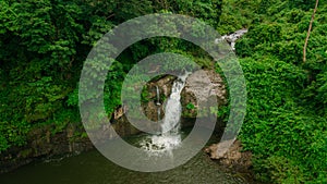 Waterfall in the middle of the forest. Bird eye view , drone