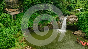 Waterfall in the middle of the forest. Bird eye view , drone