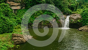 Waterfall in the middle of the forest. Bird eye view , drone