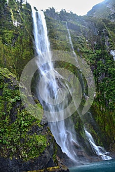 Waterfall in Milford Sound, Fjordland, New Zealand landscape