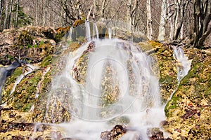 Waterfall on Mostenica travertines in the Uhliarska dolina Valley in Low Tatras mountains