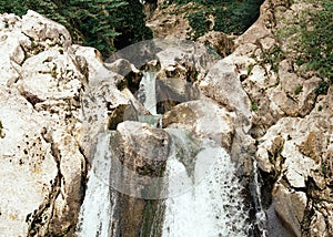 Waterfall in a mountain forest. Background