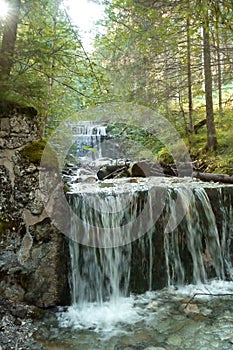 Waterfall at mountain hiking tour to Tegelberg mountain, Bavaria, Germany
