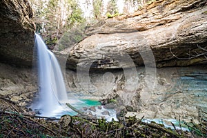 Waterfall at mountain river in spring