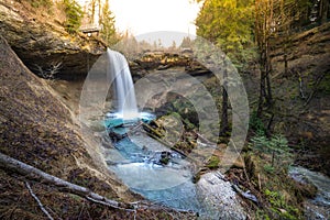 Waterfall at mountain river in spring