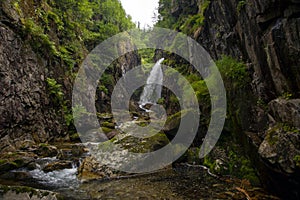 Waterfall. Mountain waterfall. Mountain river.