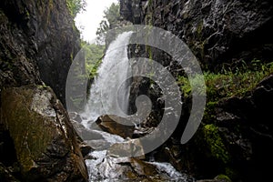 Waterfall. Mountain waterfall. Mountain river.