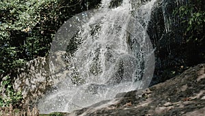 A waterfall in the mountains, a beautiful waterfall in the jungle in the amazon, a mountain stream flows down the stones