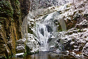 Waterfall in mountains. Famous Kamienczyk waterfall in the Karkonosze National Park in Sudety mountains photo