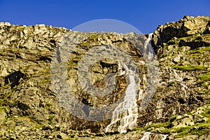 Waterfall in mountains. Norwegian route Sognefjellet