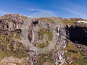 Waterfall in mountains. Norwegian route Sognefjellet