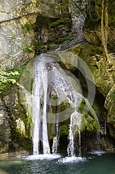 Waterfall in mountains photo