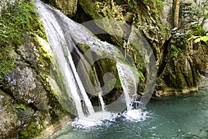 Waterfall in mountains photo