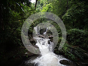 Waterfall in Nan, Thailand. Waterfalls in green rain forest. Stream from waterfall.