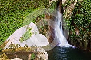 Waterfall in natural grot photo