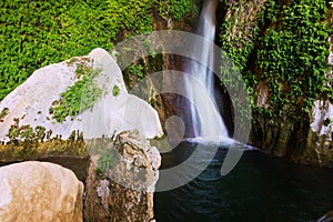 Waterfall in natural grot photo