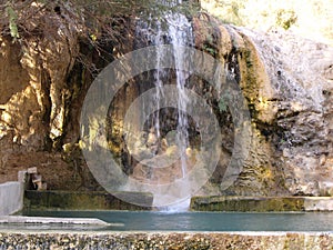 Waterfall and natural hot spring pool at Hammamat Ma`In Hot Springs, Jordan