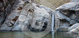 Waterfall and natural swimming pool at Cascada Sol Del Mayo on the Baja California peninsula in Mexico