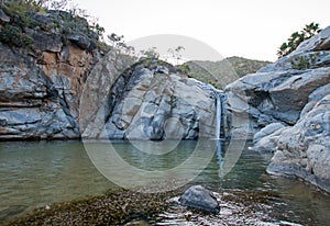 Waterfall and natural swimming pool at Cascada Sol Del Mayo on the Baja California peninsula in Mexico