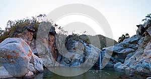 Waterfall and natural swimming pool at Cascada Sol Del Mayo on the Baja California peninsula in Mexico