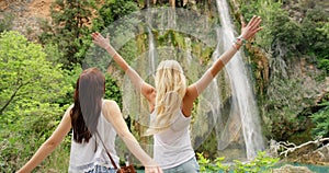 Waterfall, nature freedom and friends happy on jungle ecotourism travel for peace, adventure and mindfulness journey