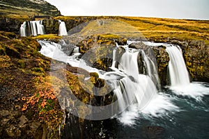 Waterfall near Kirkjufell, natural landmark of Iceland