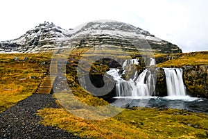 Waterfall near Kirkjufell, natural landmark of Iceland