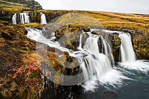Waterfall near Kirkjufell, natural landmark of Iceland