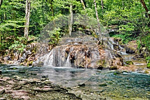 Waterfall in Nera Gorge Beusnita National Park, Romania photo