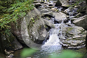 A waterfall in New River Gorge as seen while driving through the national park.