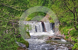 Waterfall on North Caucasus mountain river. Spring view