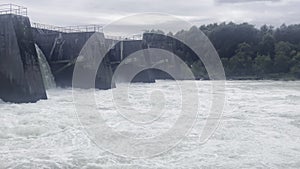 Waterfall at an open flood gate at the power plant thaling