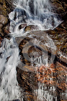 Waterfall over copper filled rocks