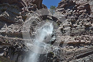 Waterfall over mountain cliff