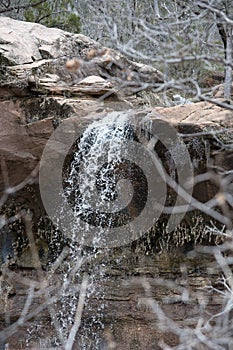 Waterfall Over Redrock Sandstone at Zion National Park in Southern Utah