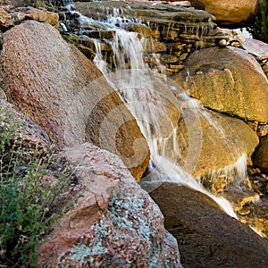 Waterfall over rocks in nature park