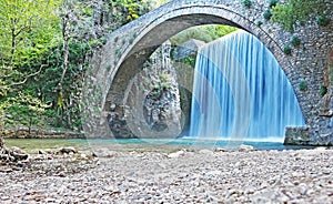 The waterfall of Palaiokaria in Trikala Thessaly Greece - stony arched bridge between the two waterfalls