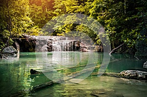 Waterfall in rain forest in summer, the warmest season of the year in Thailand