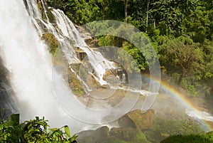 Waterfall with a rainbow in a jungle at Wachiran Waterfall in Doi Inthanon National park in Chiang Mai, Thailand.