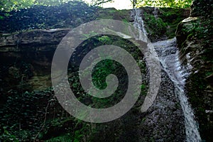 Waterfall from ravine.waterfall from the mountain river. rapid current