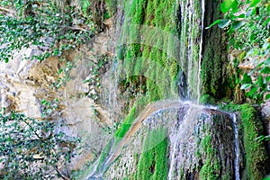 Waterfall from ravine.waterfall from the mountain river. rapid current