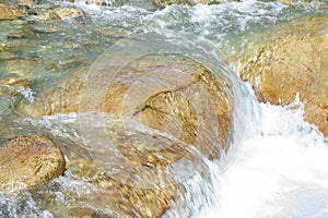 Waterfall from ravine.waterfall from the mountain river. rapid current